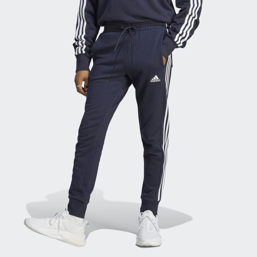 adidas Essentials French Terry Tapered Cuff 3-Stripes Pants - Blue | Lifestyle | adidas US