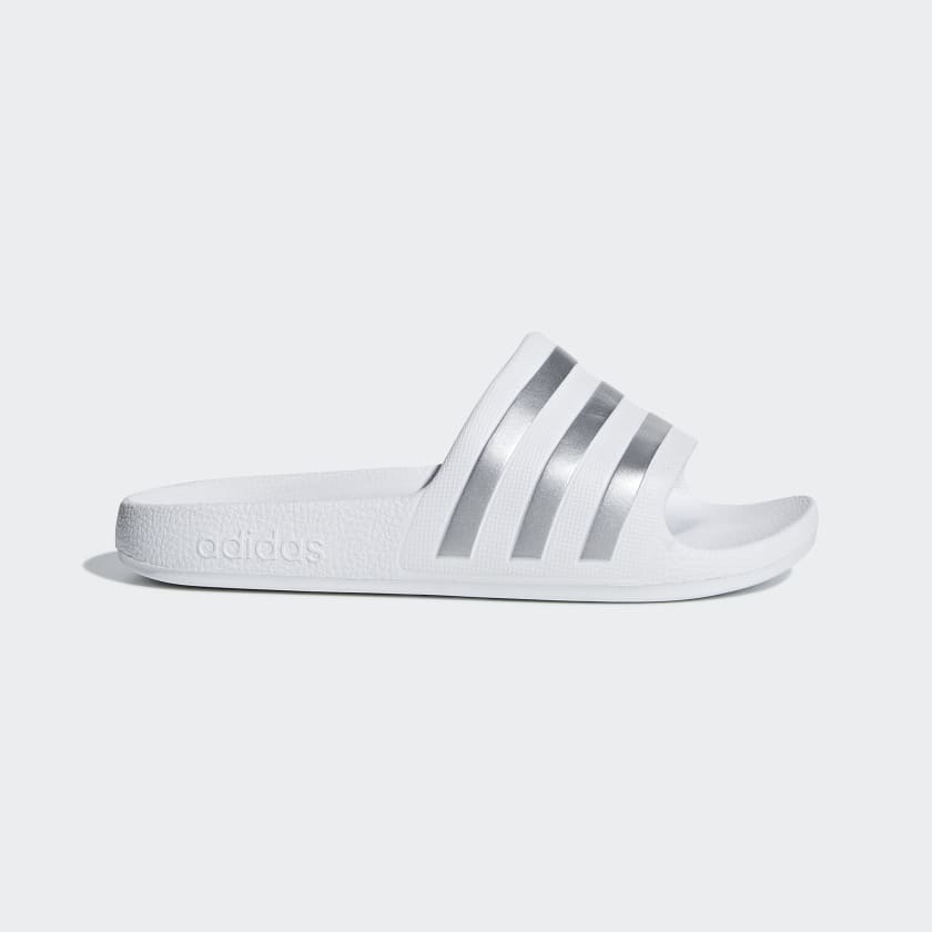 White and silver adidas slides top