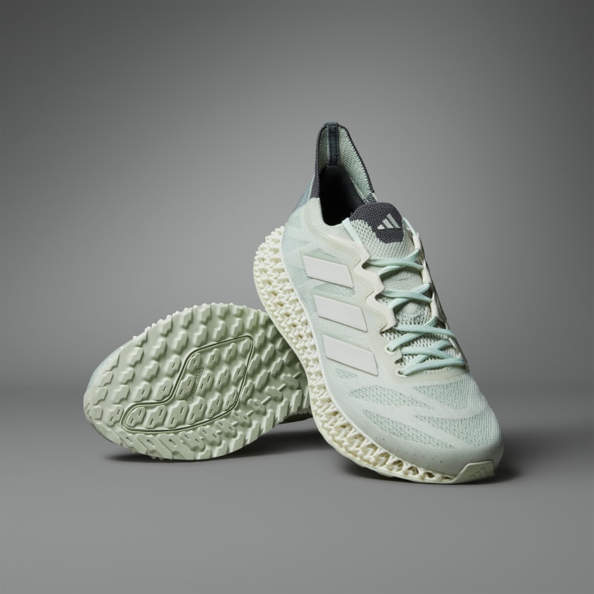 Green and white adidas running shoes 2025