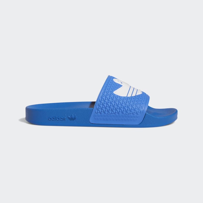 Glow blue adidas slides cheap