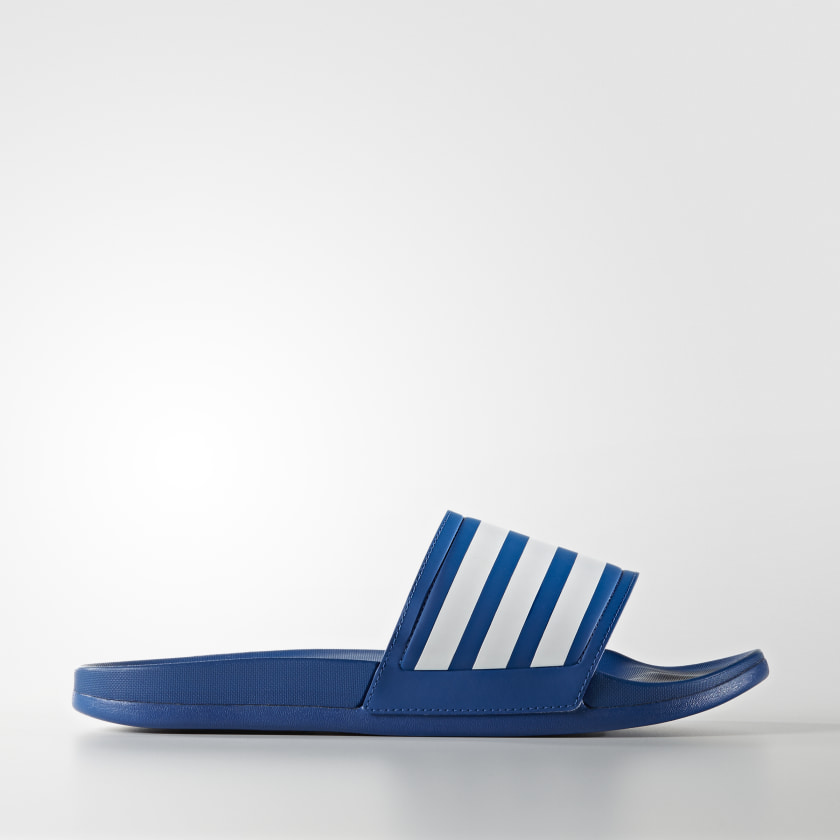 white and blue adidas slides