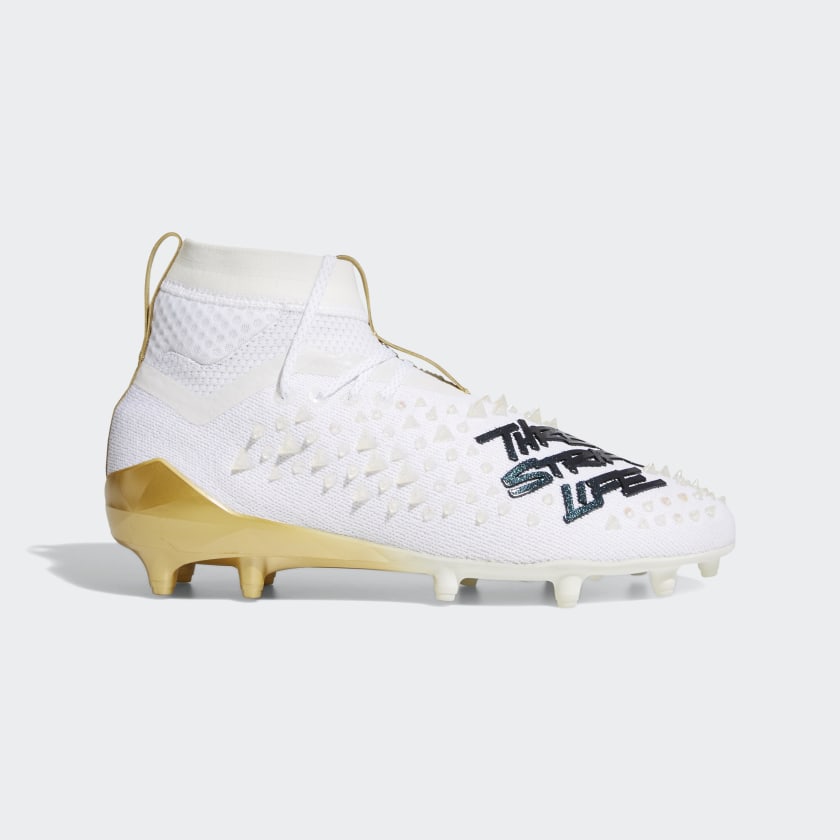 white adidas cleats