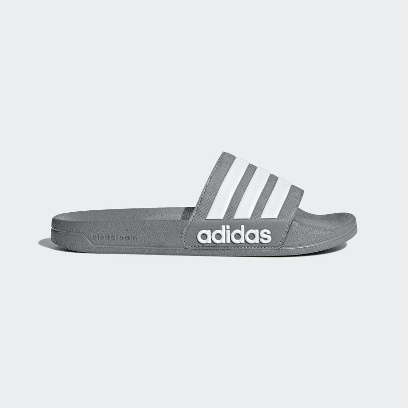 white and grey adidas slides