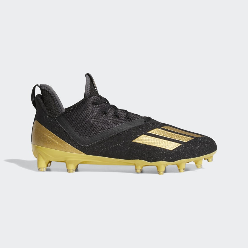 nike gold and black football cleats