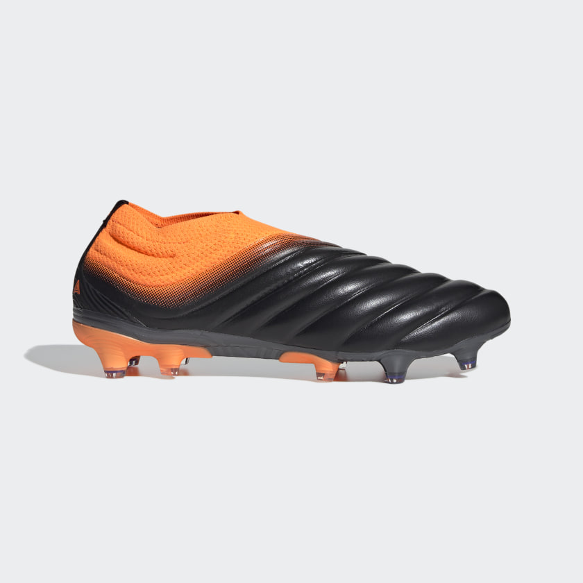orange and black soccer cleats