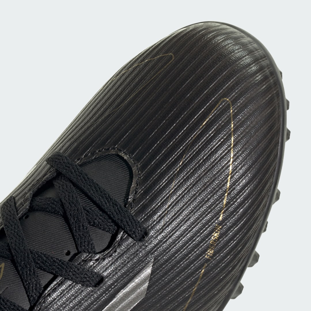 

adidas Tacos de Fútbol F50 Club Pasto Sintético Unisex, Negro/iron gris/oro gris