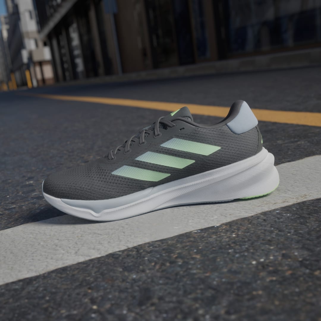 

adidas Tenis de Running Supernova Stride Unisex, Carbon/verde spark/wonder azul