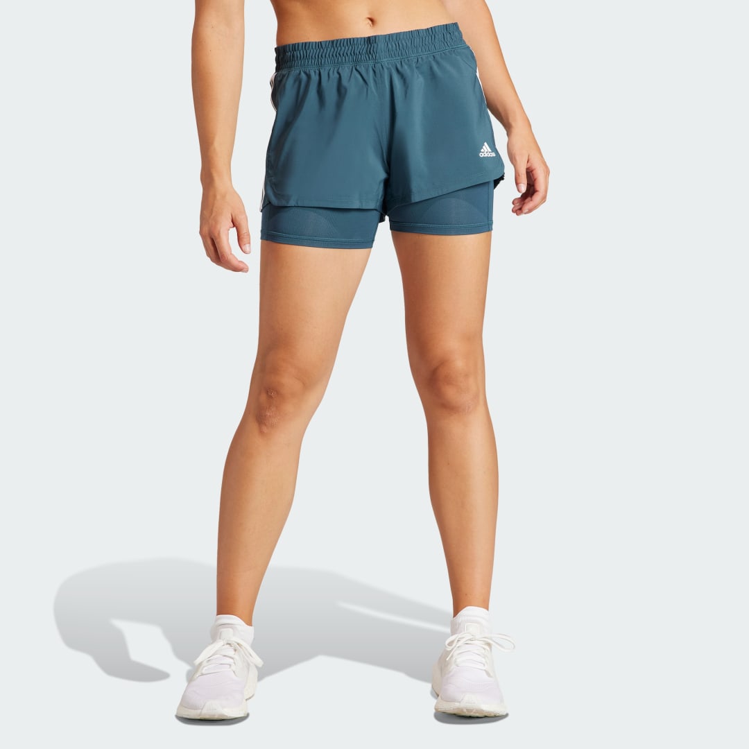 

adidas Shorts Dos en Uno Pacer 3 Rayas Tejidos Mujer, Blanco