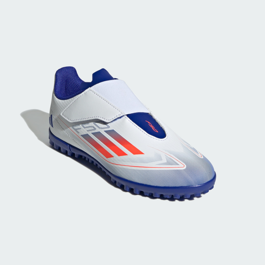 

adidas Calzado de Fútbol F50 Club Cierre por Contacto Pasto Sintético Niños, Blanco/solar rojo/lucid azul