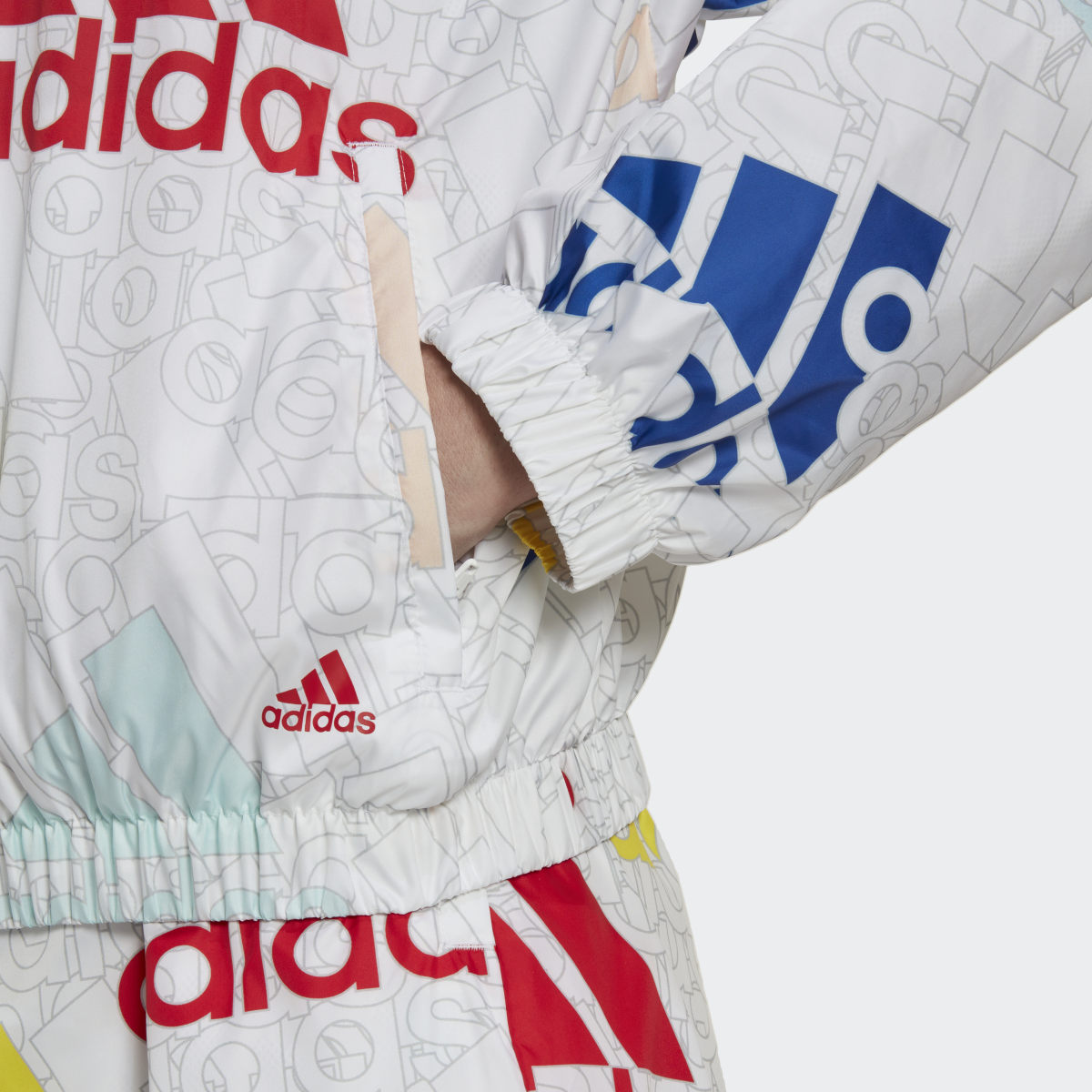 Adidas Essentials Multi-Colored Logo Loose Fit Windbreaker. 6