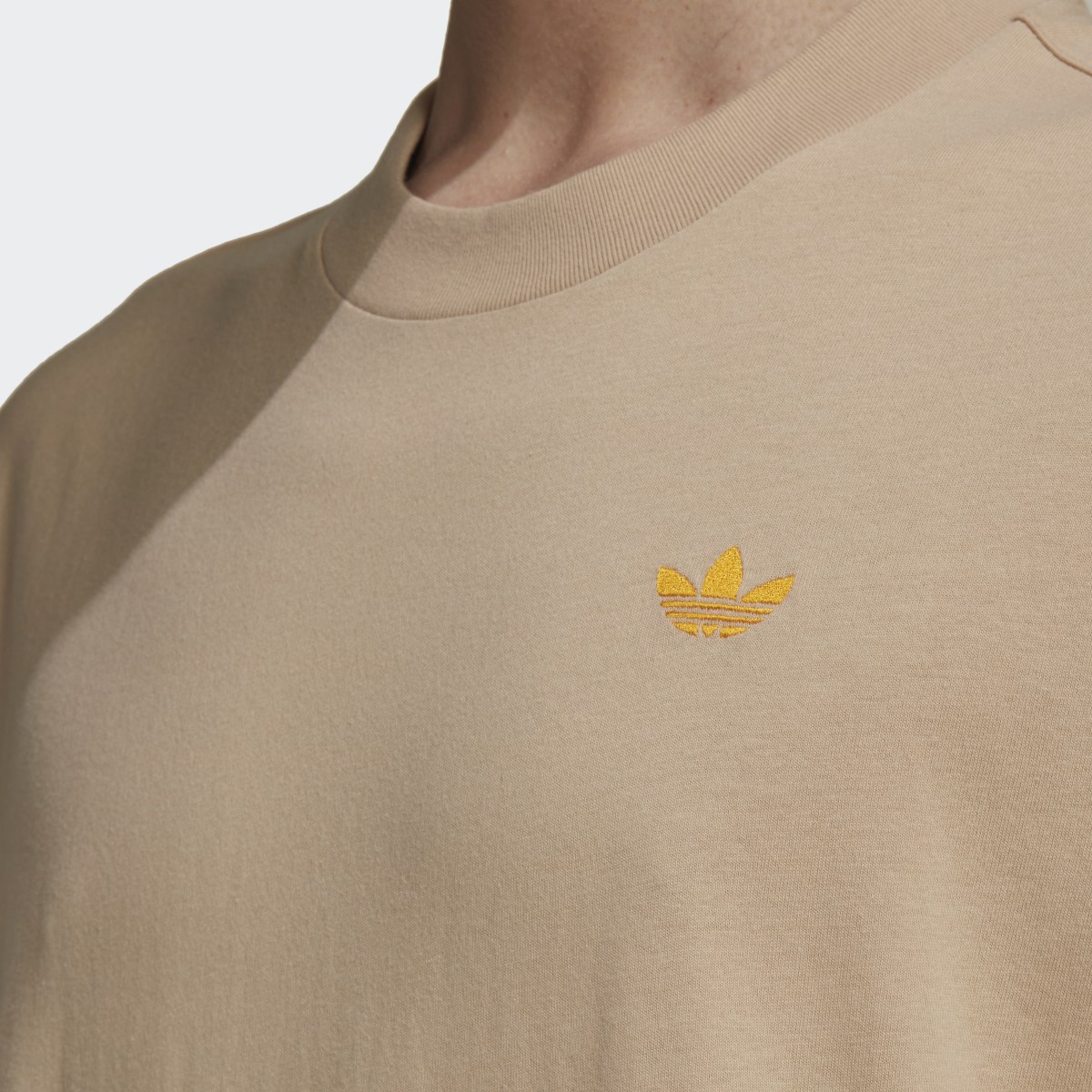 Adidas Varsity Loose Tee. 6