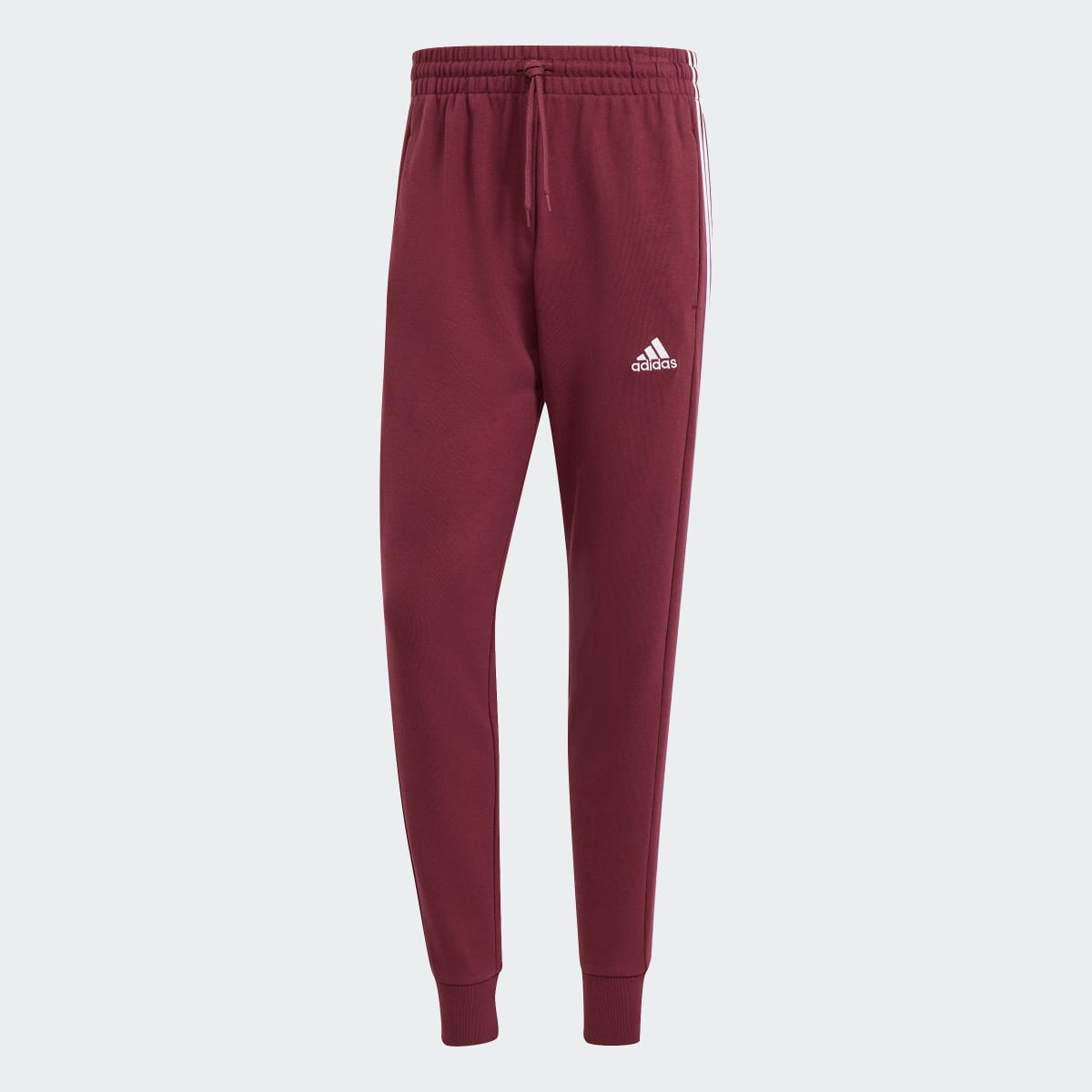 Adidas Essentials French Terry Tapered Cuff 3-Stripes Joggers. 4