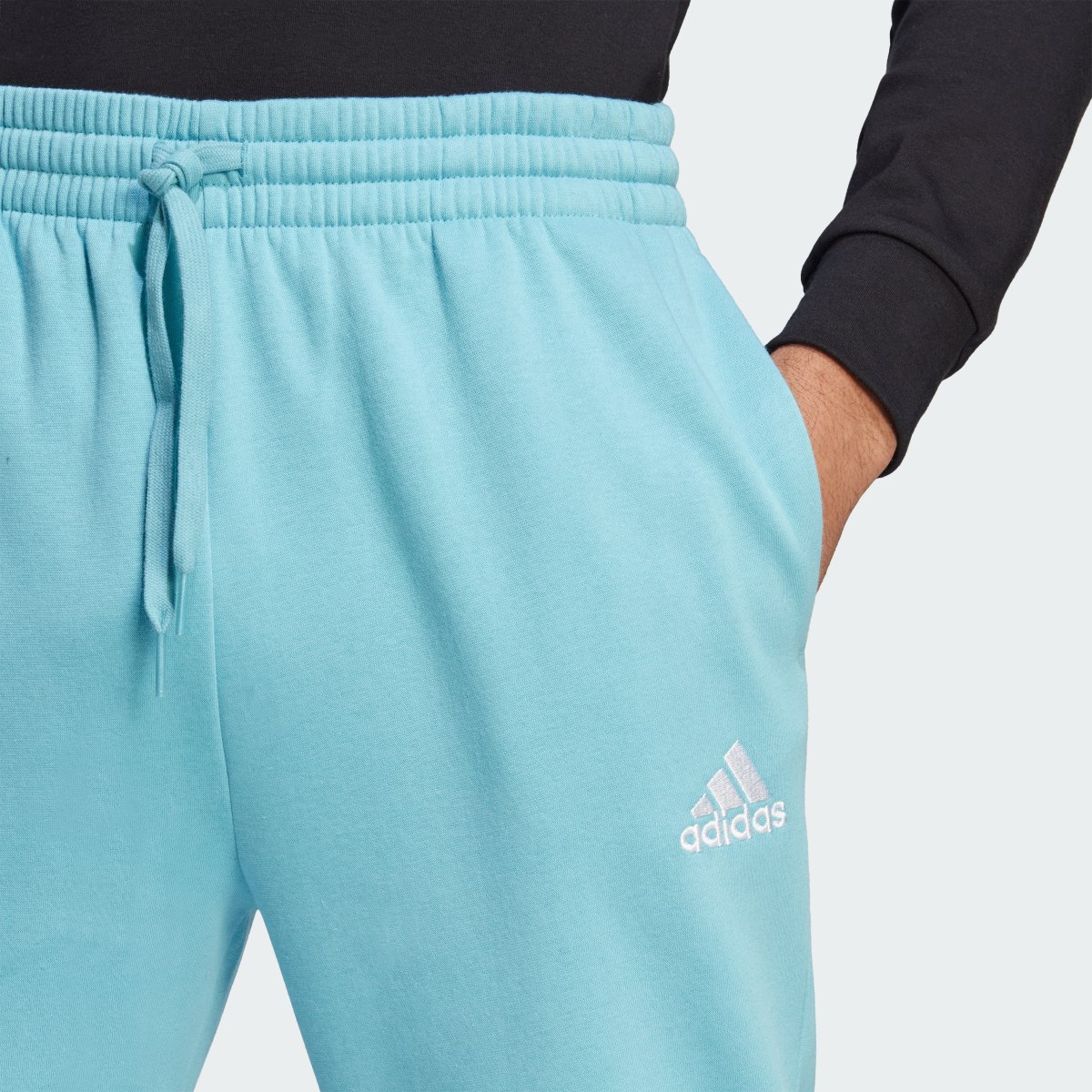 Adidas Essentials Fleece Regular Tapered Hose. 5