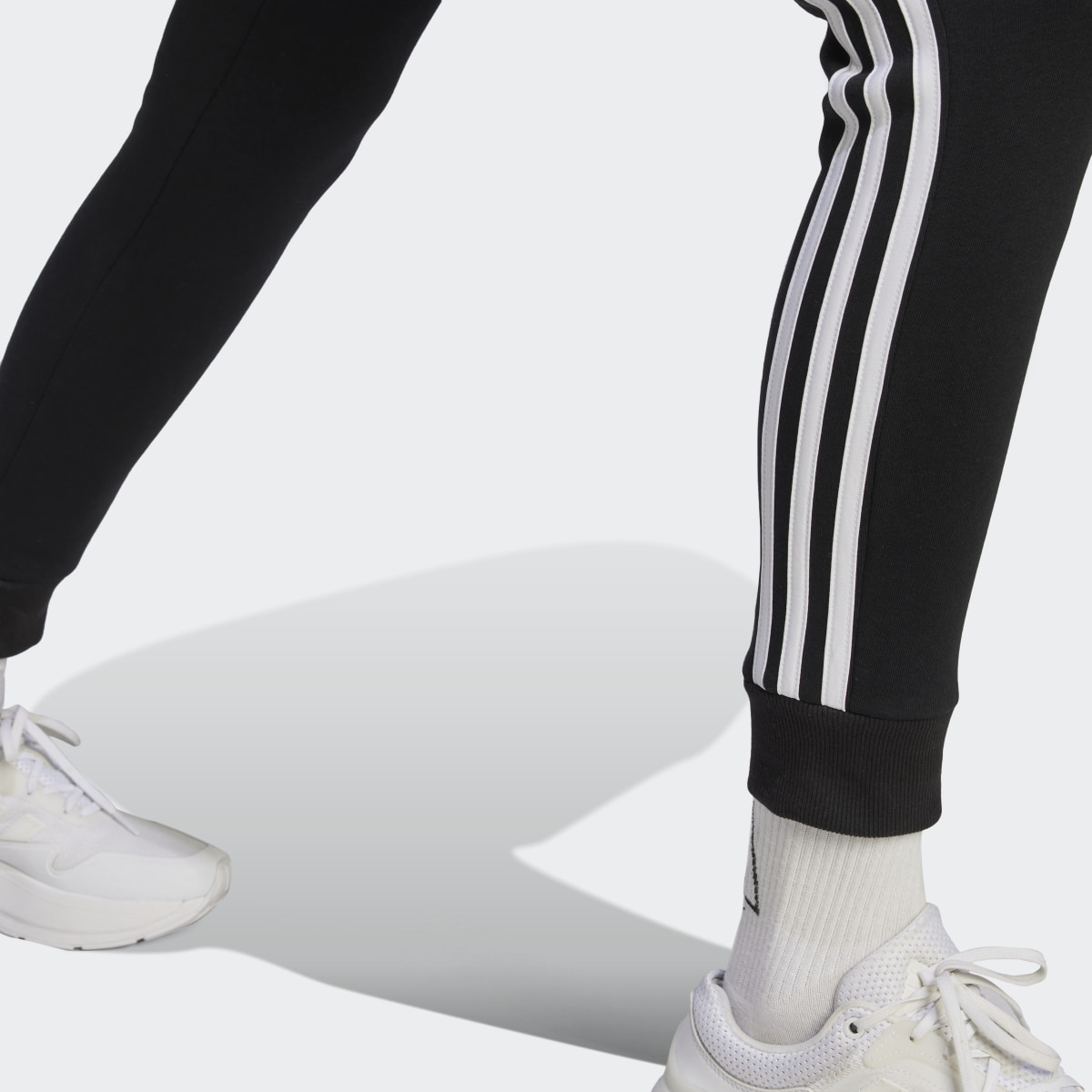 Adidas Essentials 3-Stripes Fleece Pants. 6