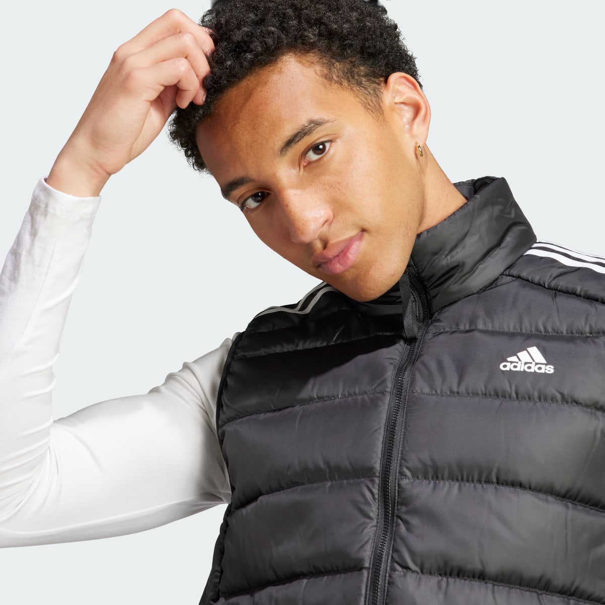 Adidas Doudoune sans manches légère 3 bandes Essentials. 6