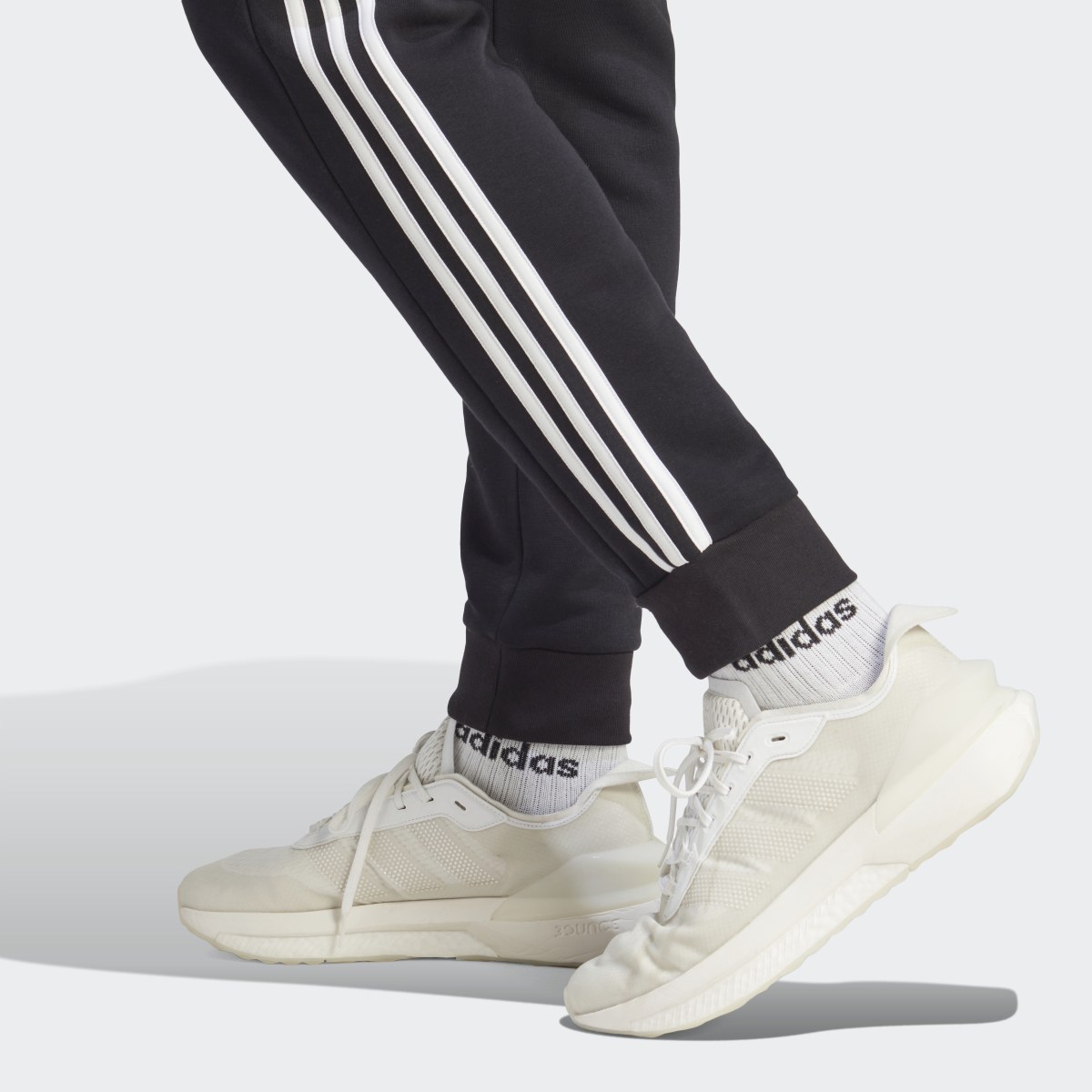 Adidas Essentials Fleece 3-Stripes Tapered Cuff Pants. 6