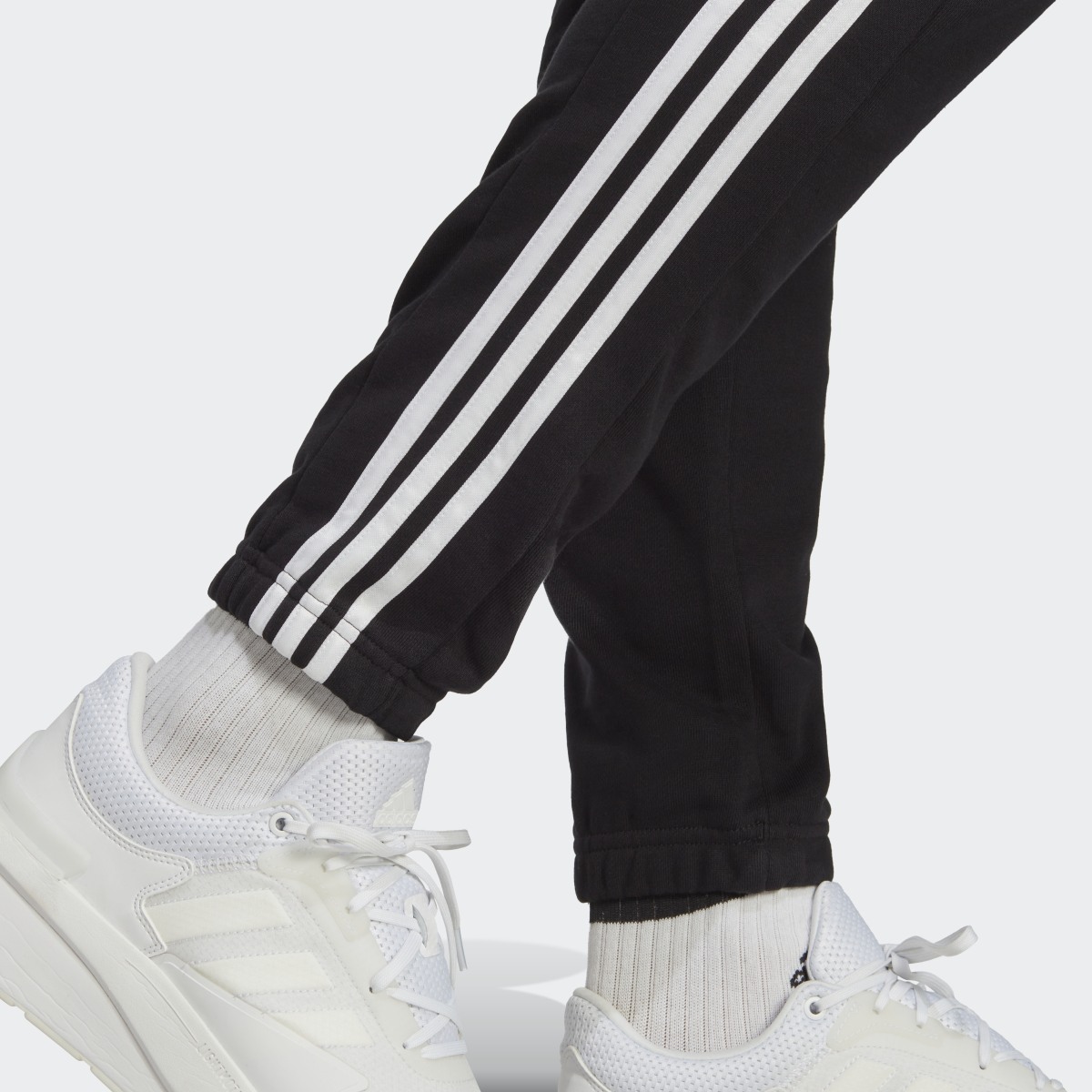 Adidas Essentials French Terry Tapered Elastic Cuff 3-Stripes Joggers. 6