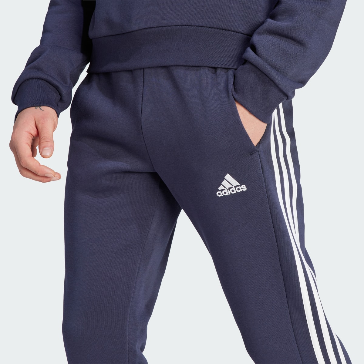 Adidas Essentials Fleece 3-Stripes Tapered Cuff Pants. 5