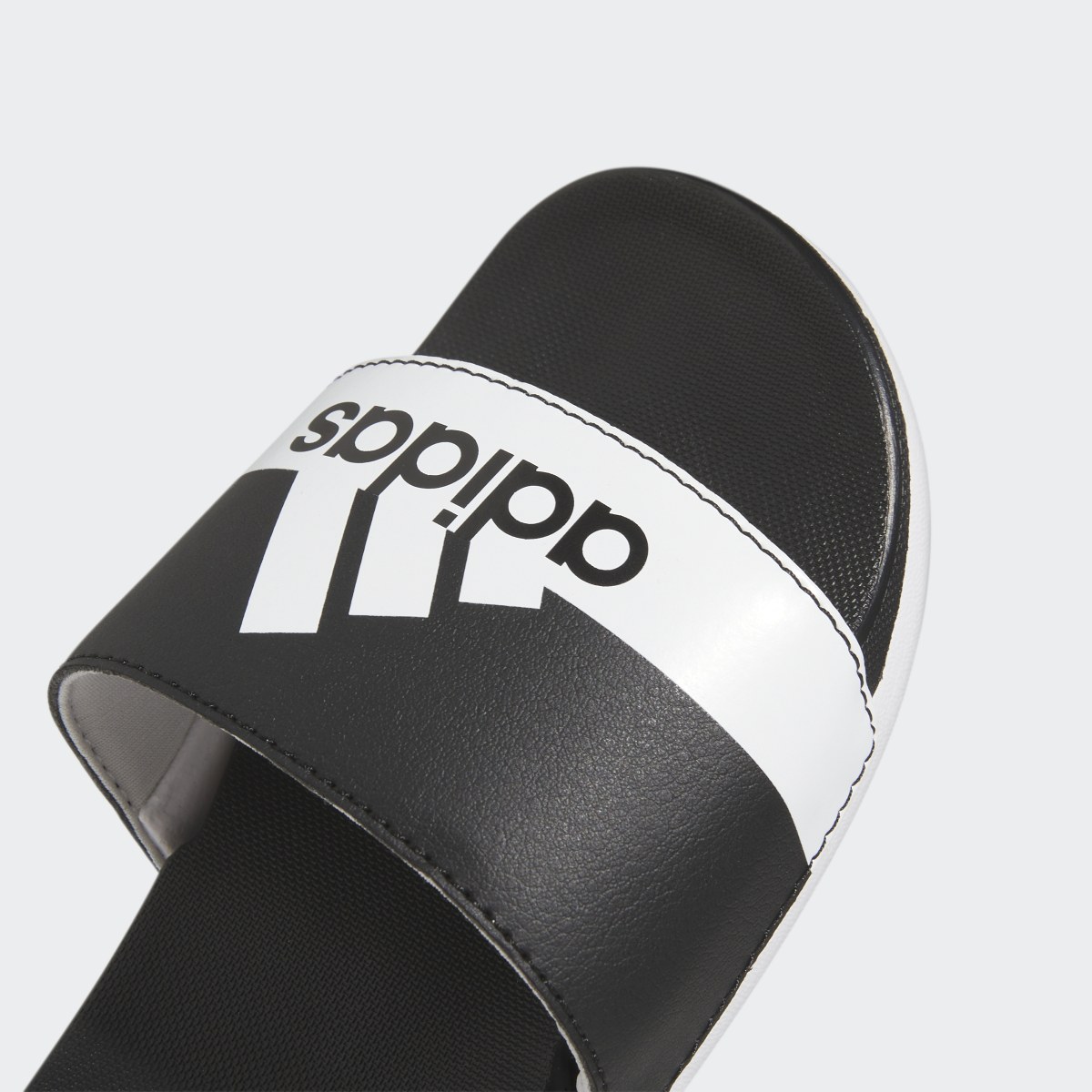 Adidas Adilette Comfort Slides. 11