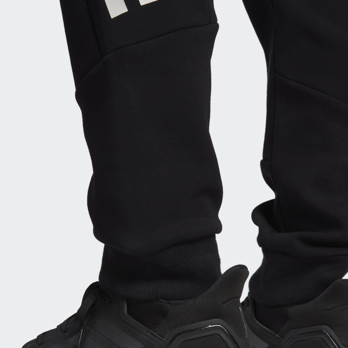 Adidas Pantalon à 3 bandes Future Icons. 7