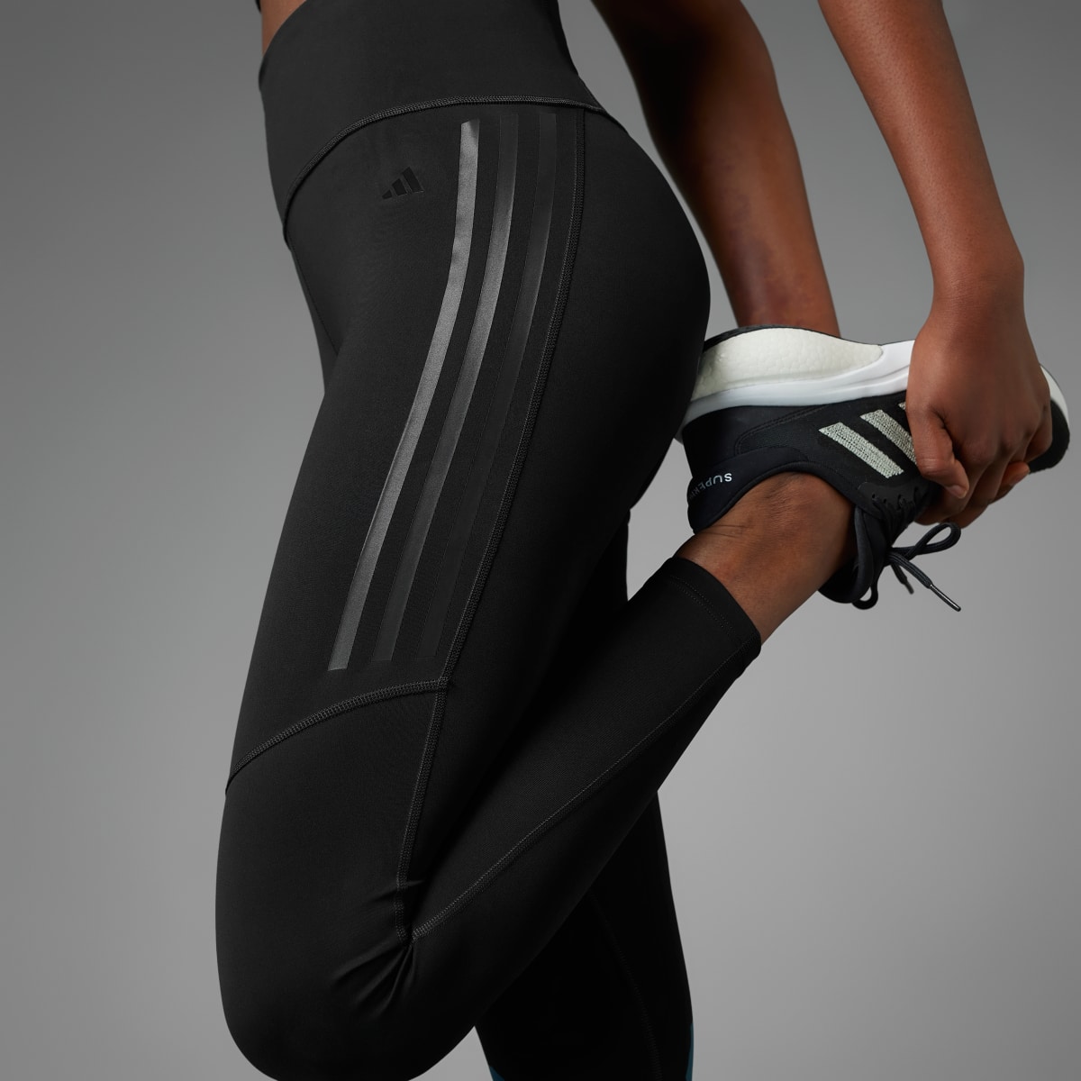 Adidas DailyRun 3-Streifen 7/8-Leggings. 5