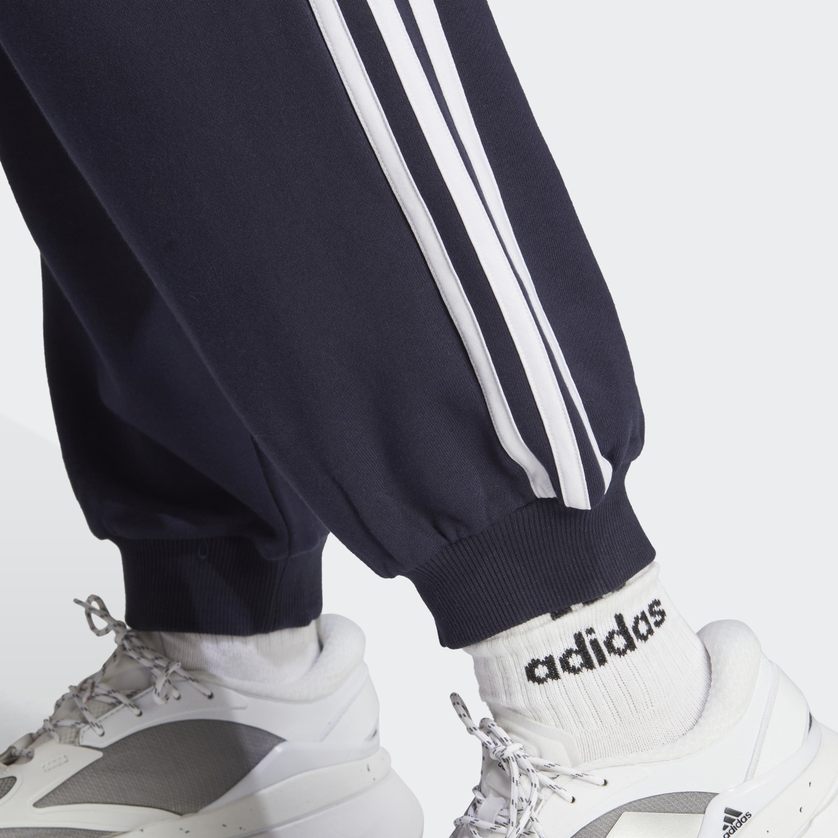 Adidas Essentials 3-Stripes French Terry Loose-Fit Joggers. 6