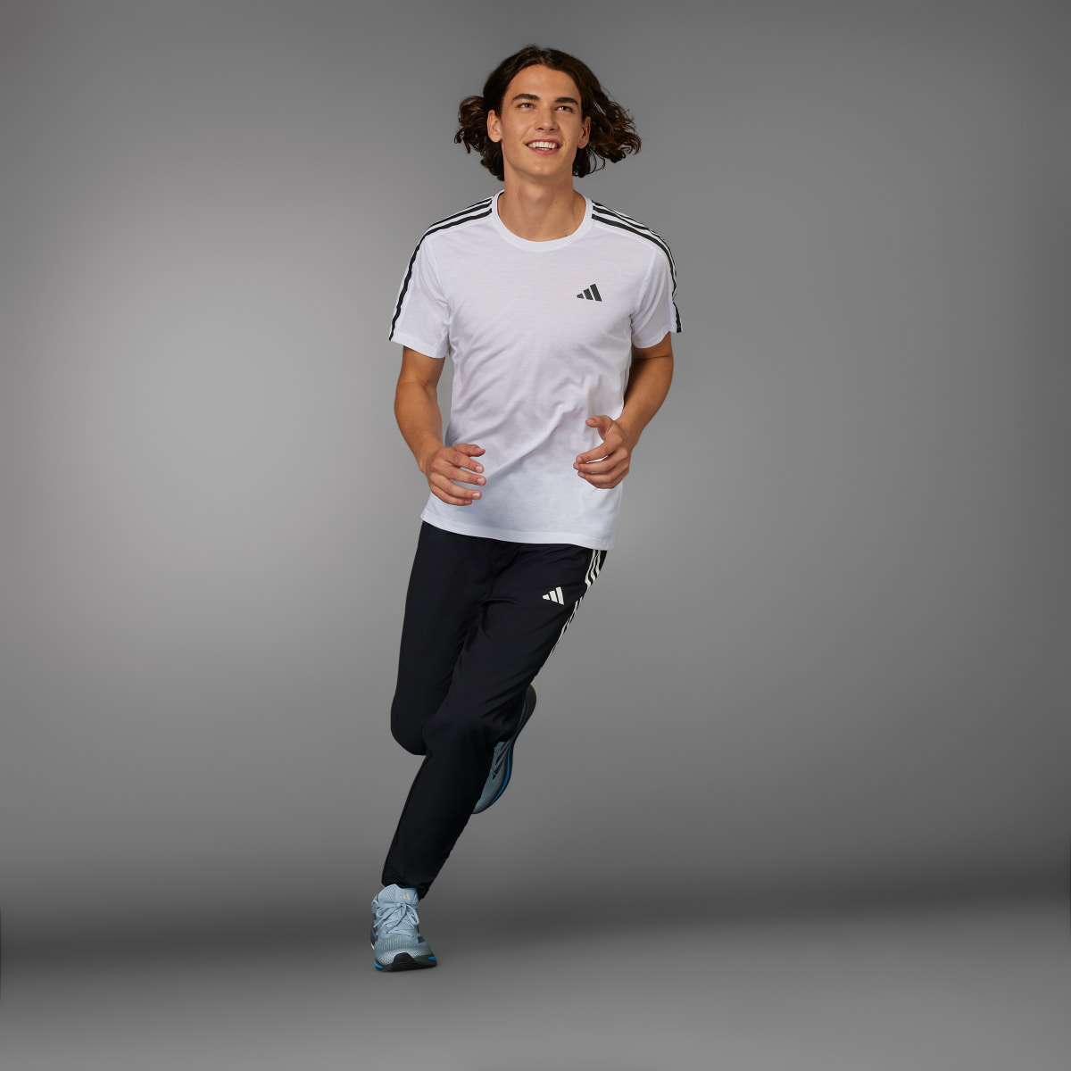 Adidas Own the Run 3-Streifen Hose. 5