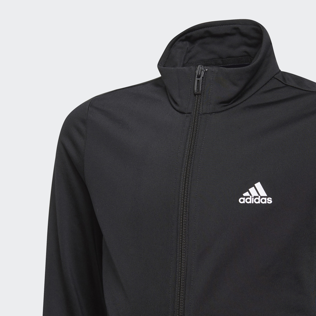 Adidas Essentials Tracksuit. 7