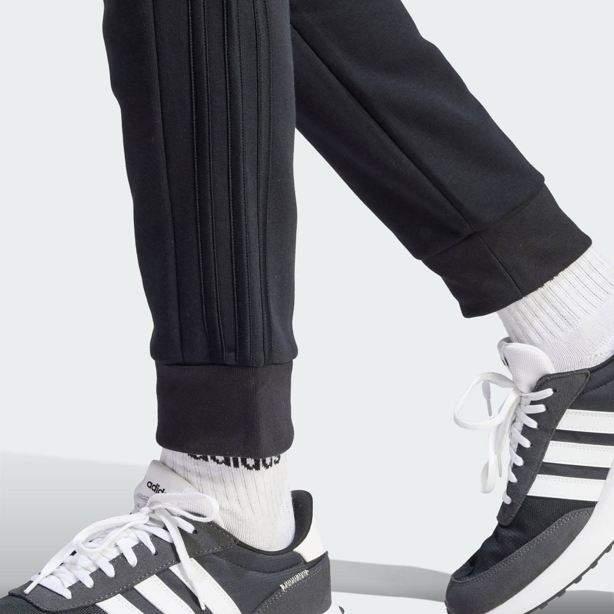 Adidas Essentials Fleece 3-Stripes Tapered Cuff Pants. 6