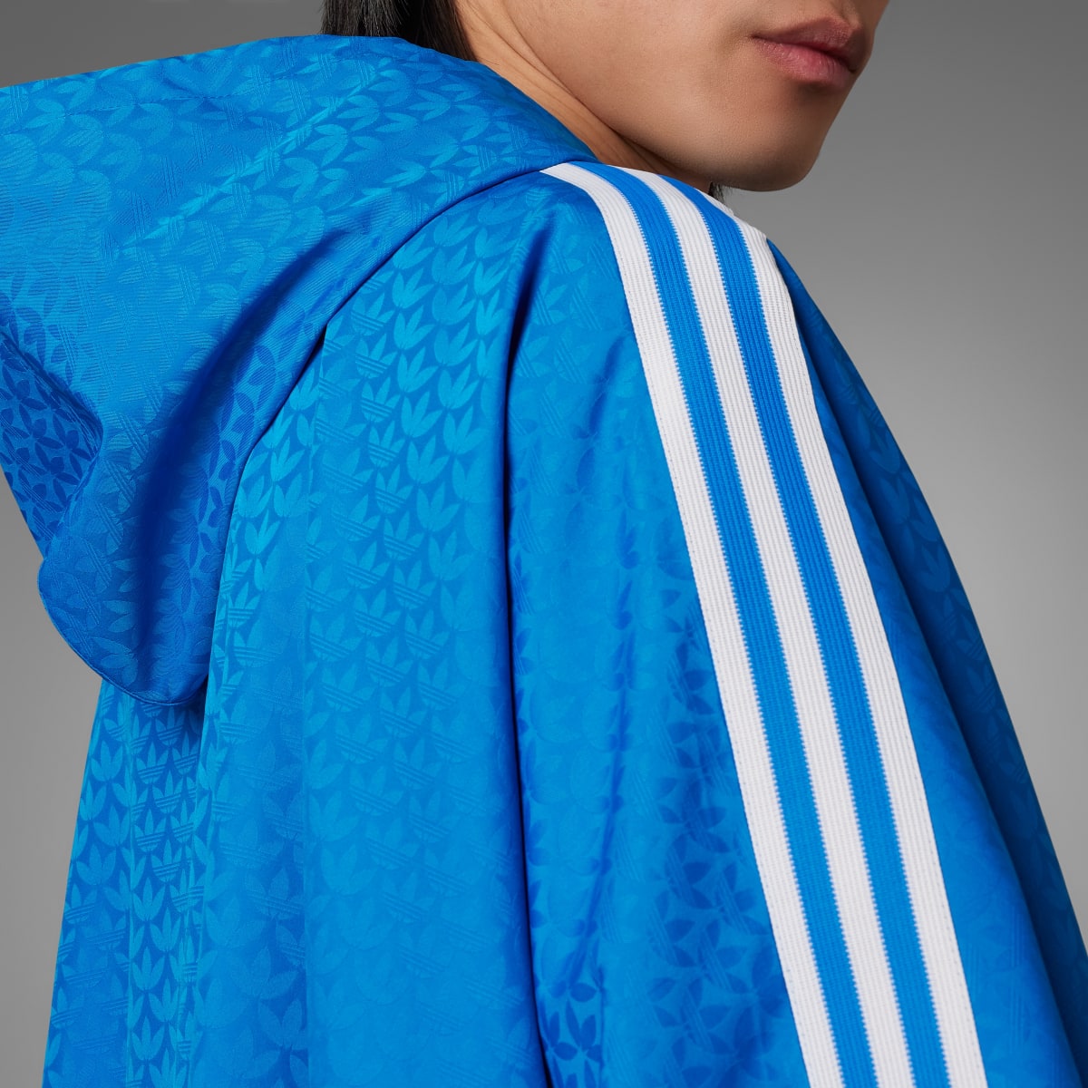 Adidas Adicolor 70s Monogram Poncho. 5 Adidas Adicolor 70s Monogram Poncho. 5