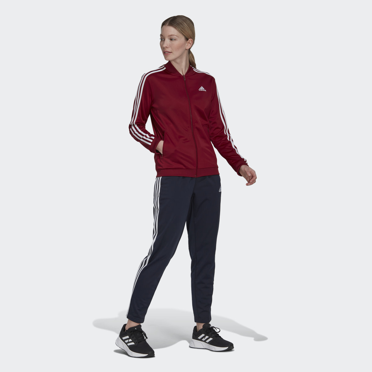 Adidas Essentials 3-Streifen Trainingsanzug. 4