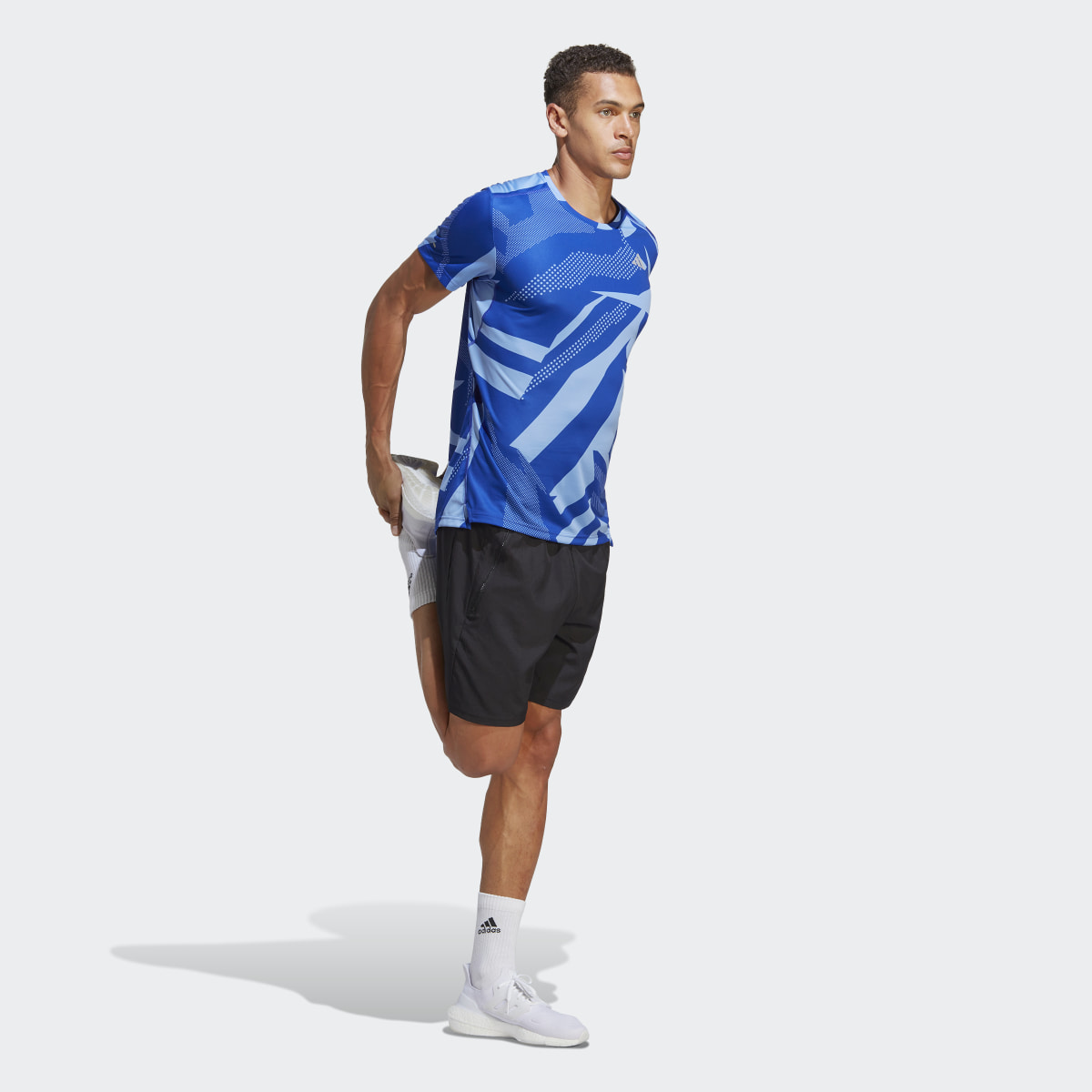 Adidas Playera Own the Run Seasonal. 4