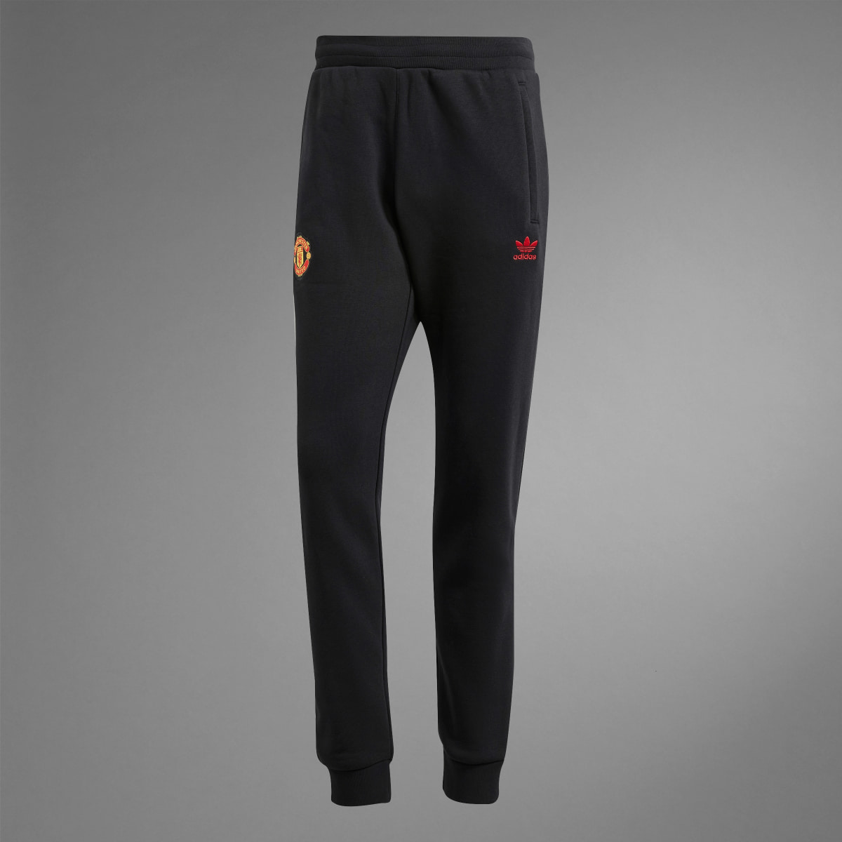 Adidas Pantaloni Essentials Trefoil Manchester United FC. 9