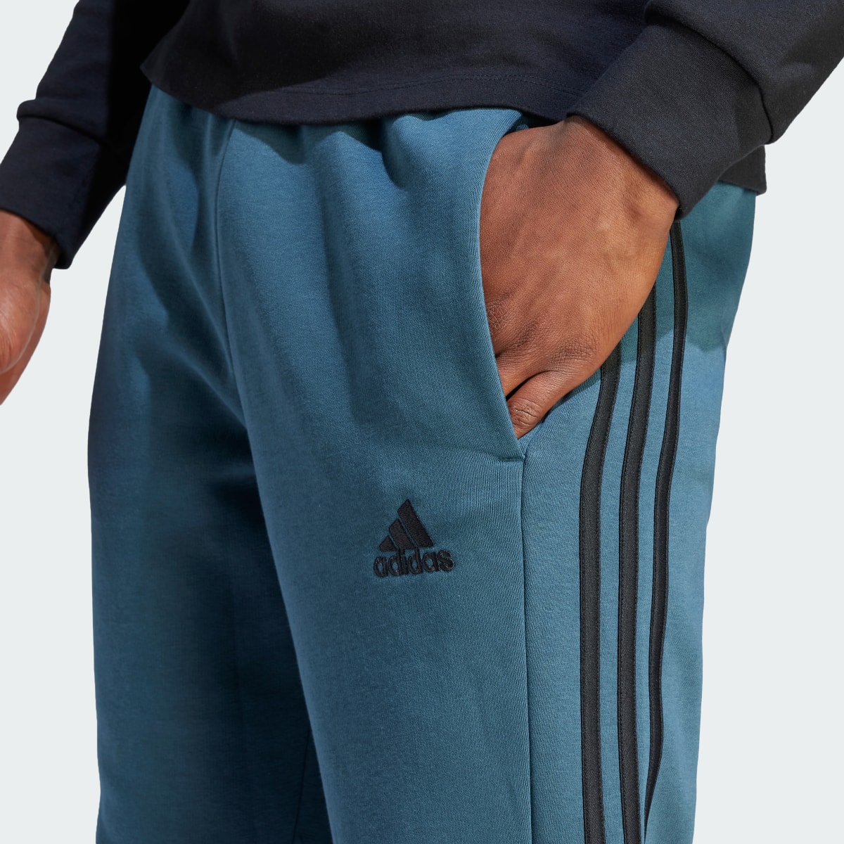 Adidas Essentials Fleece 3-Stripes Tapered Cuff Pants. 5