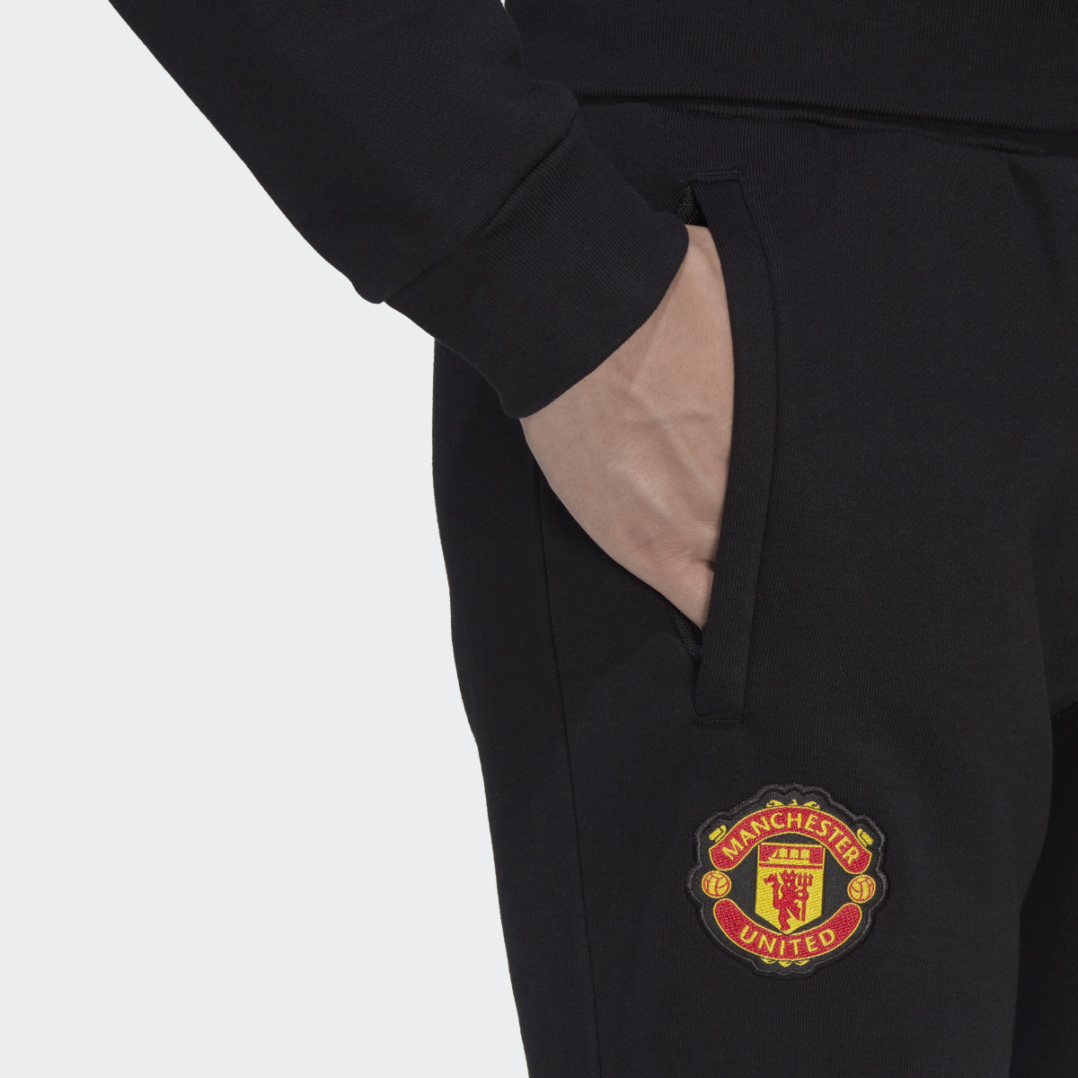 Adidas Manchester United Essentials Trefoil Tracksuit Bottoms. 5