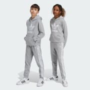 Adidas originals joggers with trefoil print in grey store