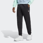 Adidas originals joggers with sales trefoil print in black