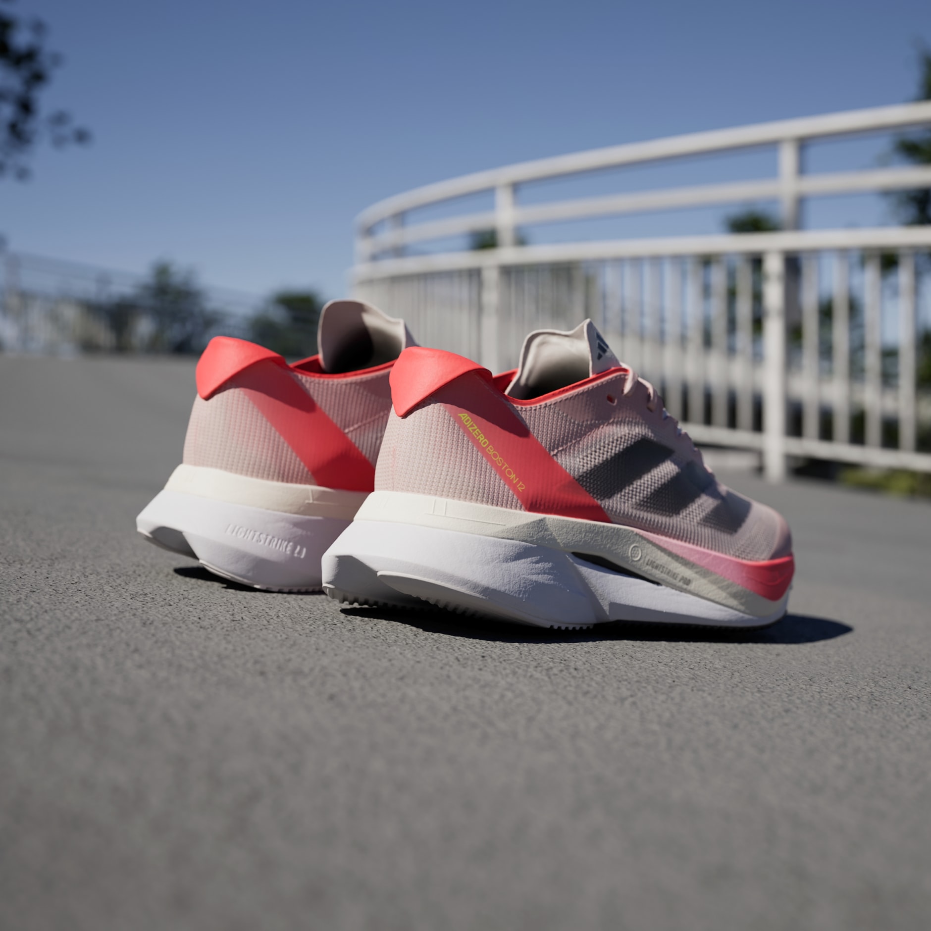 SHOES - Adizero Boston 12 Shoes - Pink | adidas Oman
