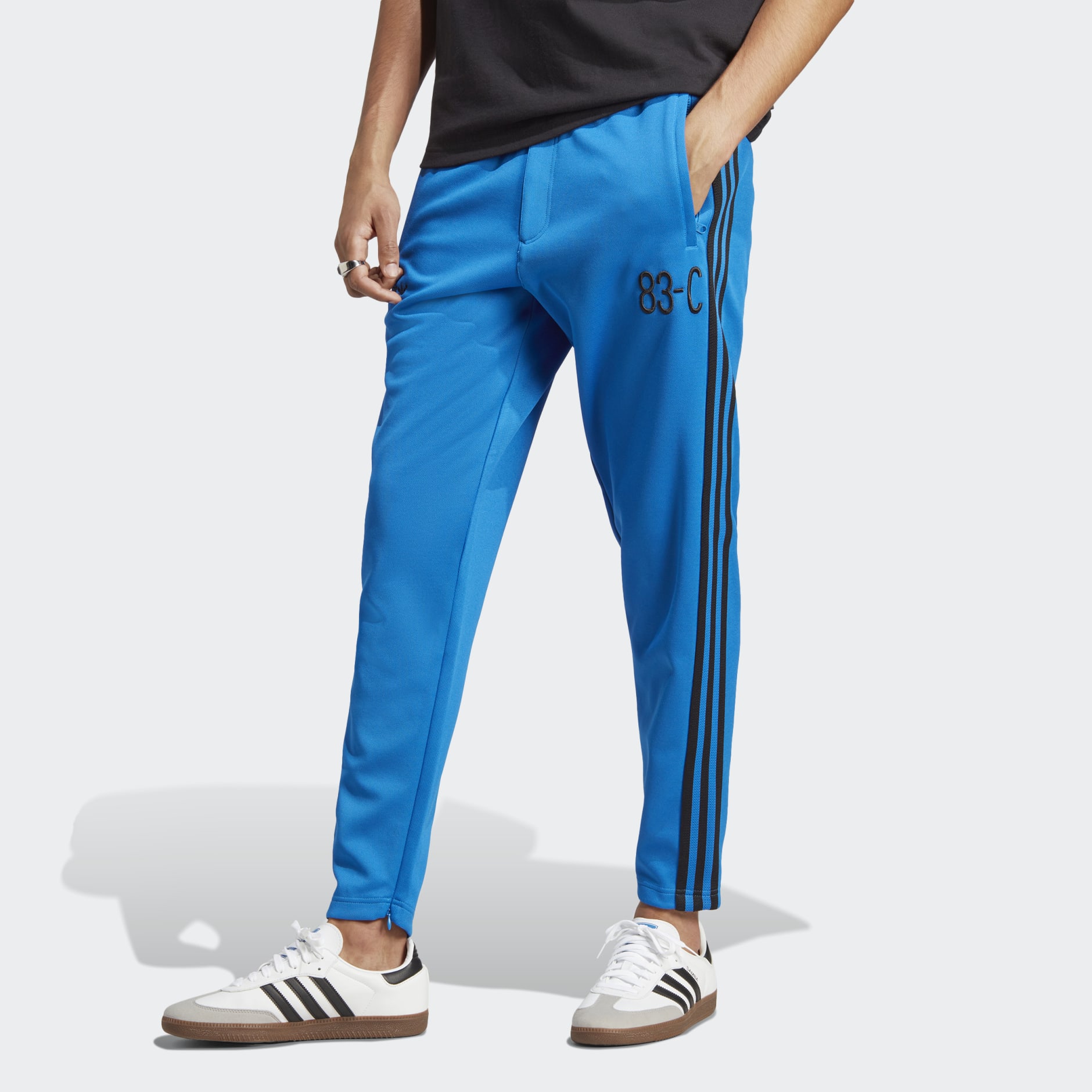 Men's Clothing - 83-C Track Pants - Blue | adidas Saudi Arabia