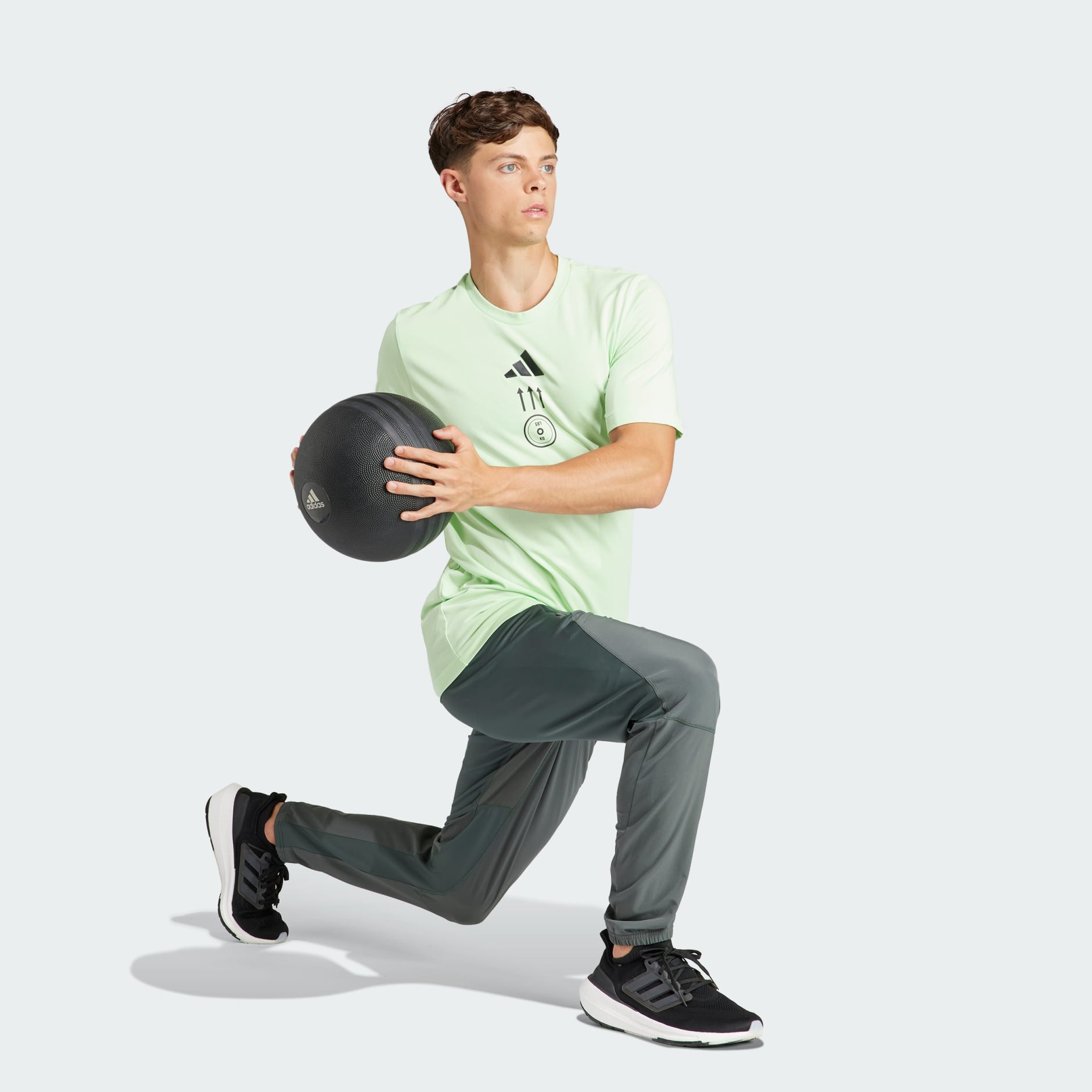 Men's Clothing - AEROREADY Strength Graphic Tee - Green | adidas Kuwait