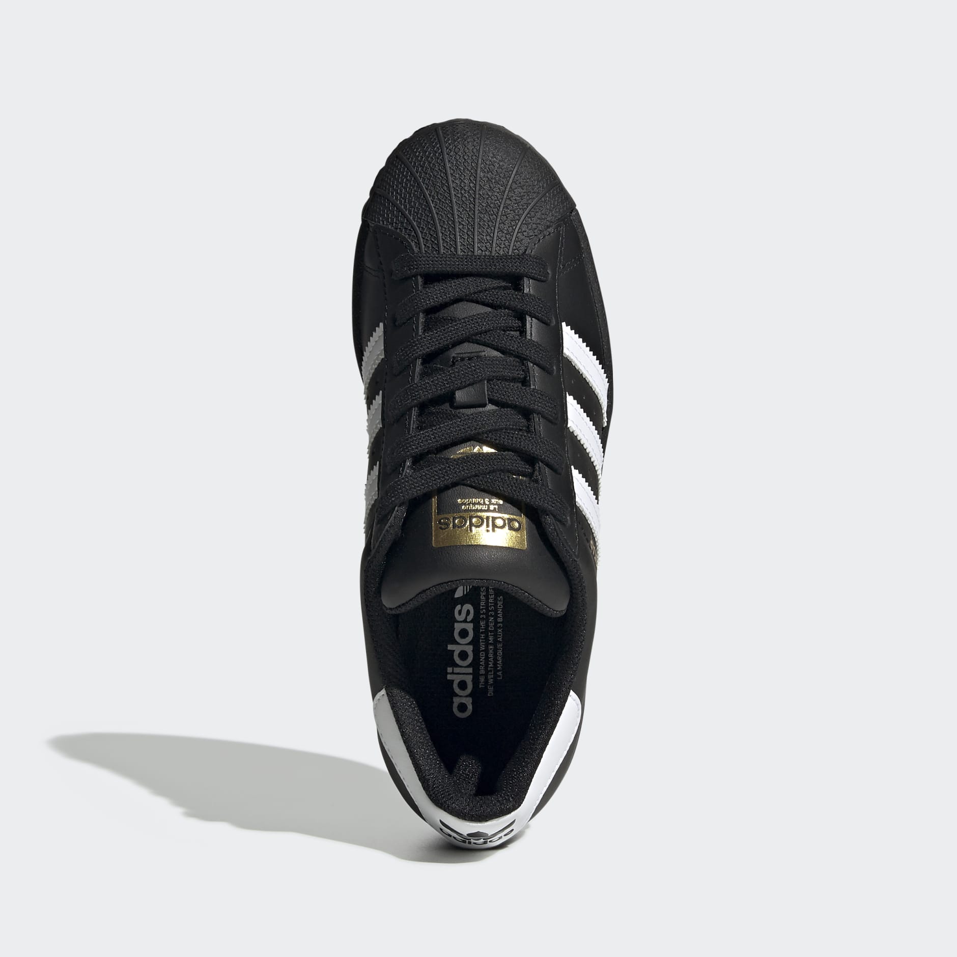 Adidas superstar shoes shop with gold stripes