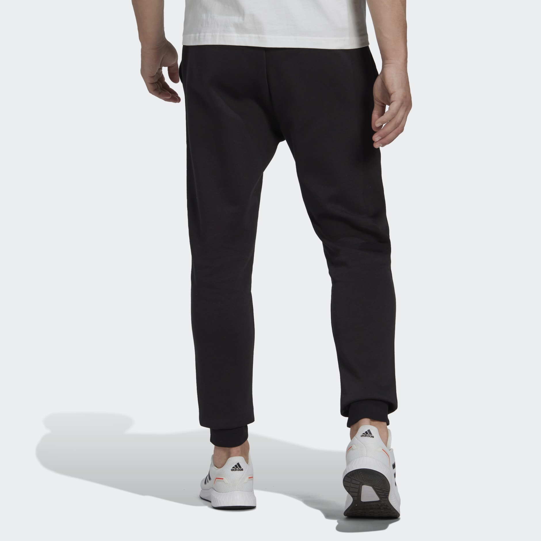 adidas Essentials Fleece Regular Tapered Pants - Black | adidas UAE