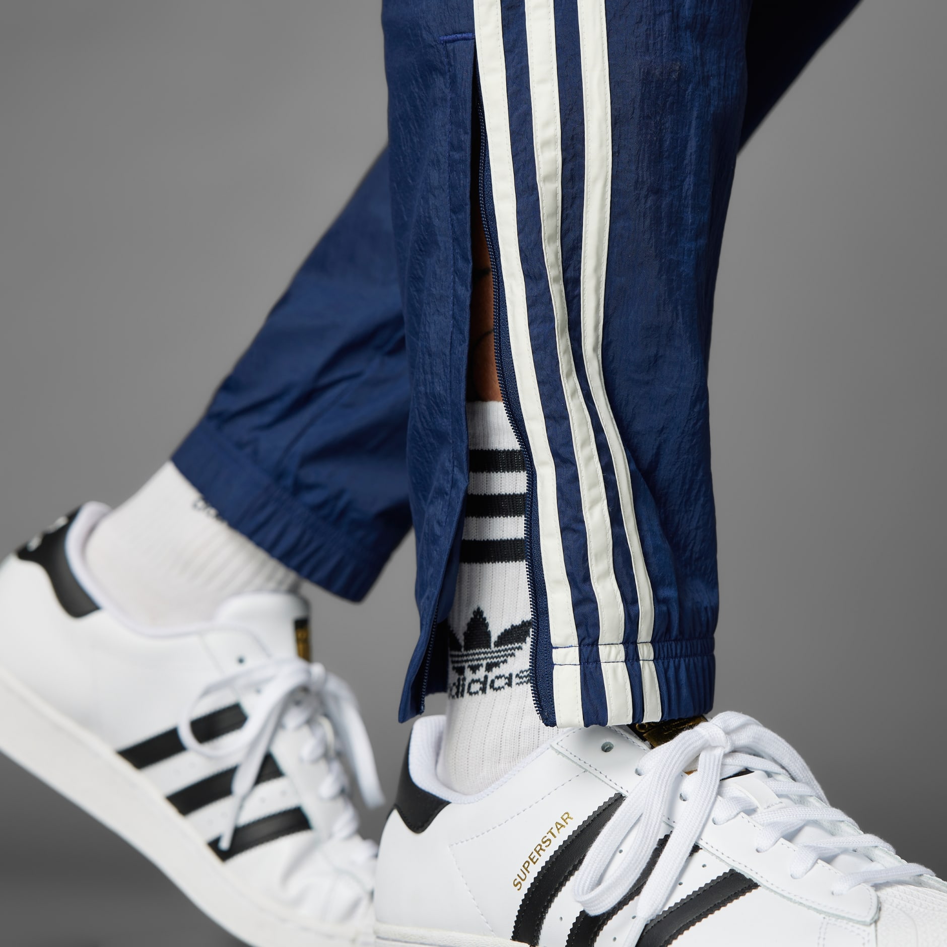 Mens blue adidas superstar track pants best sale