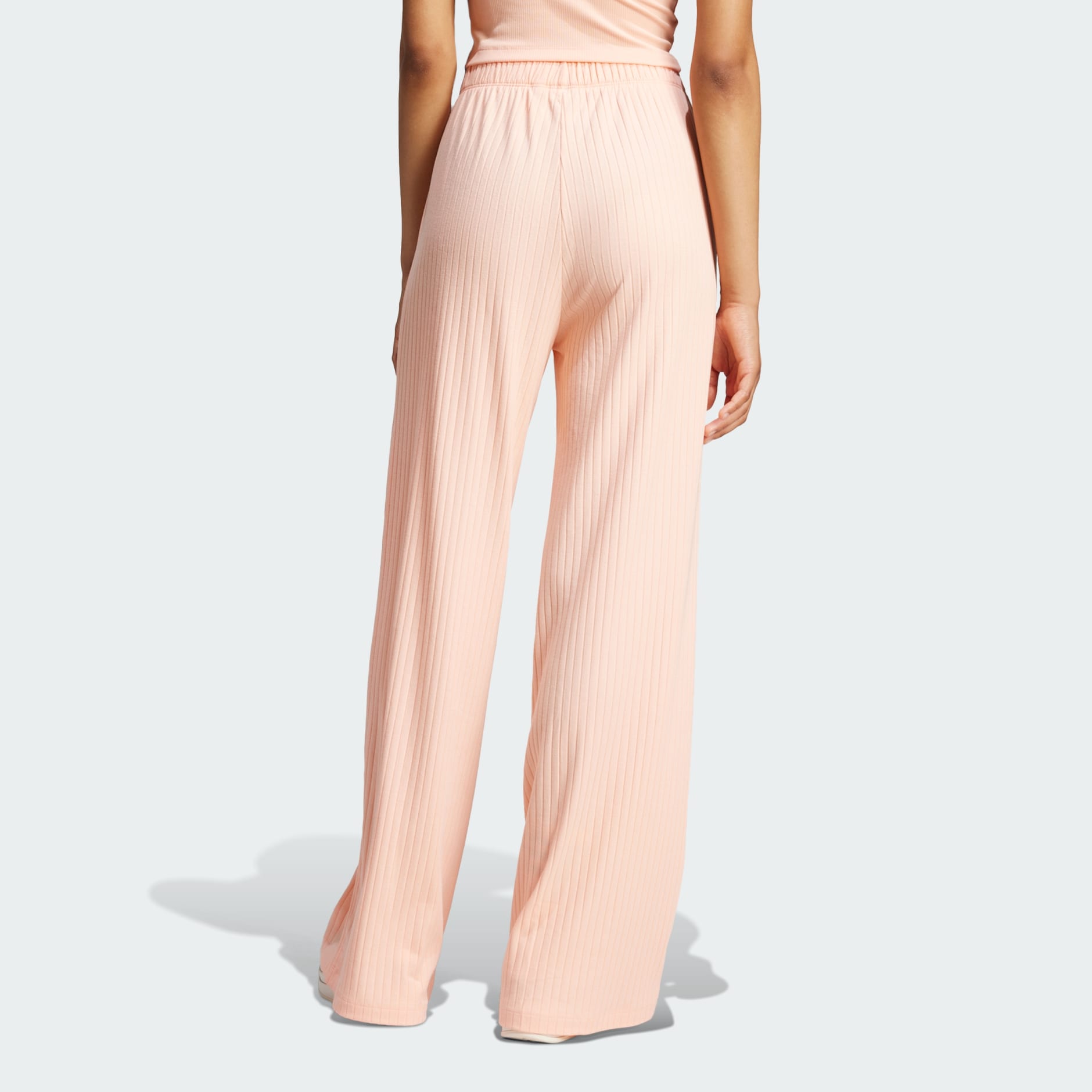 CLOTHING - Essentials Wide Rib Pants - Pink | adidas Oman