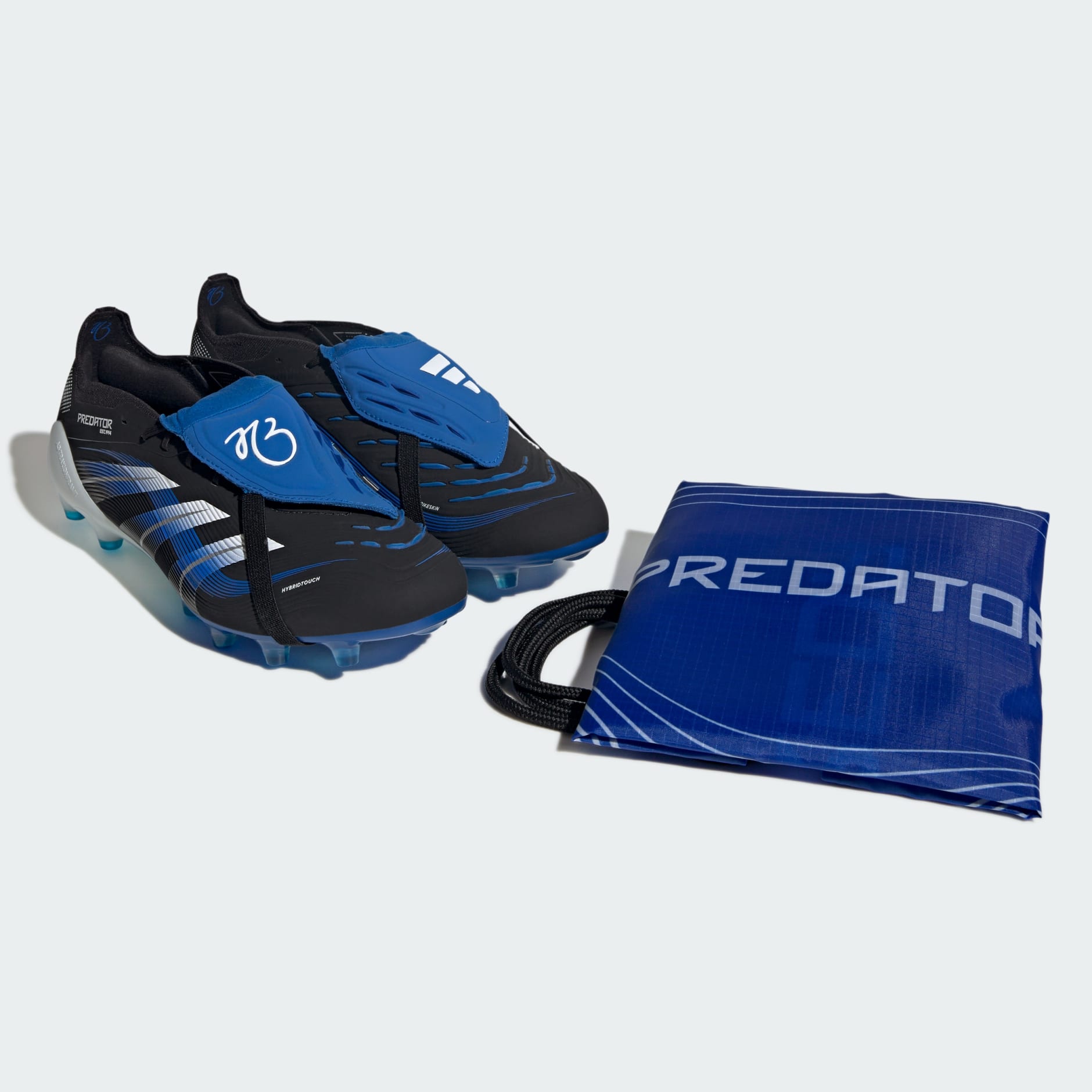 Ghete Predator Elite JB cu limbă pliabilă pentru gazon artificial