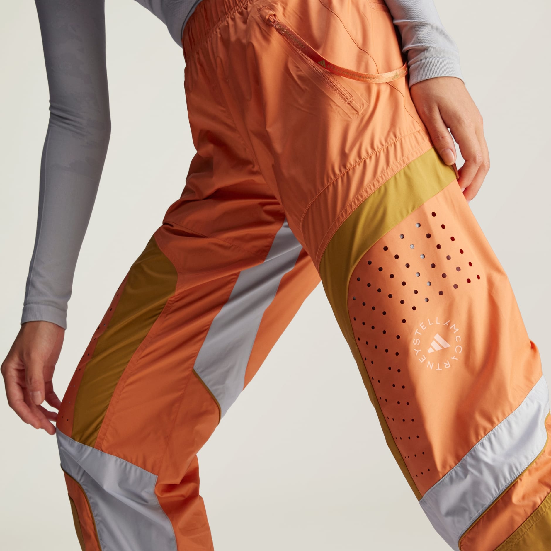 Adidas track pants orange online