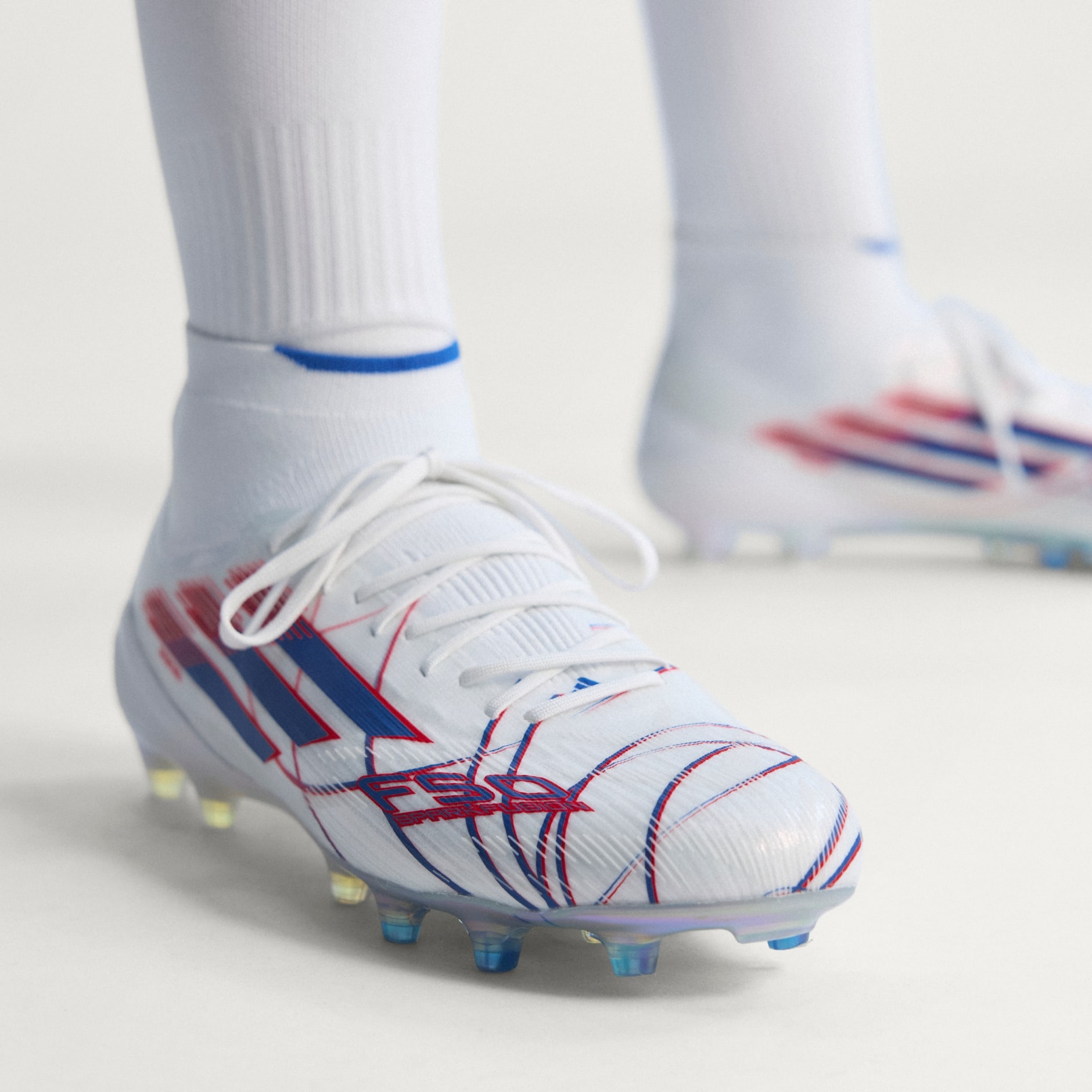 Ghete de fotbal pentru teren ferm sau gazon artificial F50 SPARKFUSION ELITE Mid-Cut, de damă