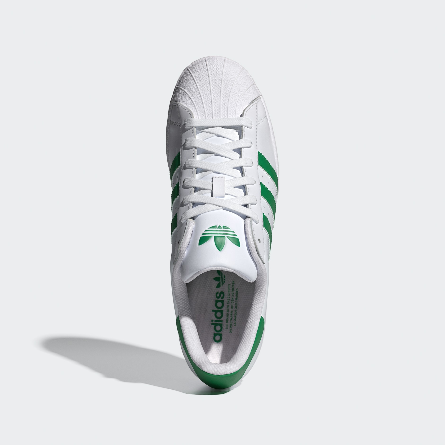 Adidas superstar white with green stripes hotsell