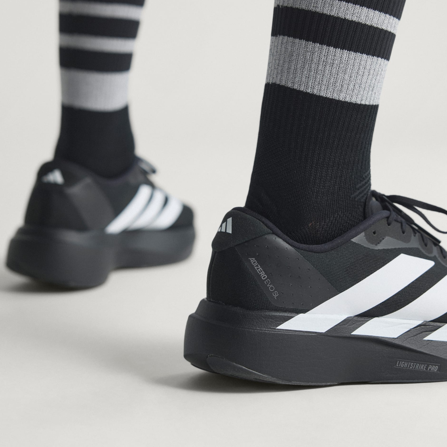 Shoes - Adizero EVO SL Shoes - Black | adidas Oman