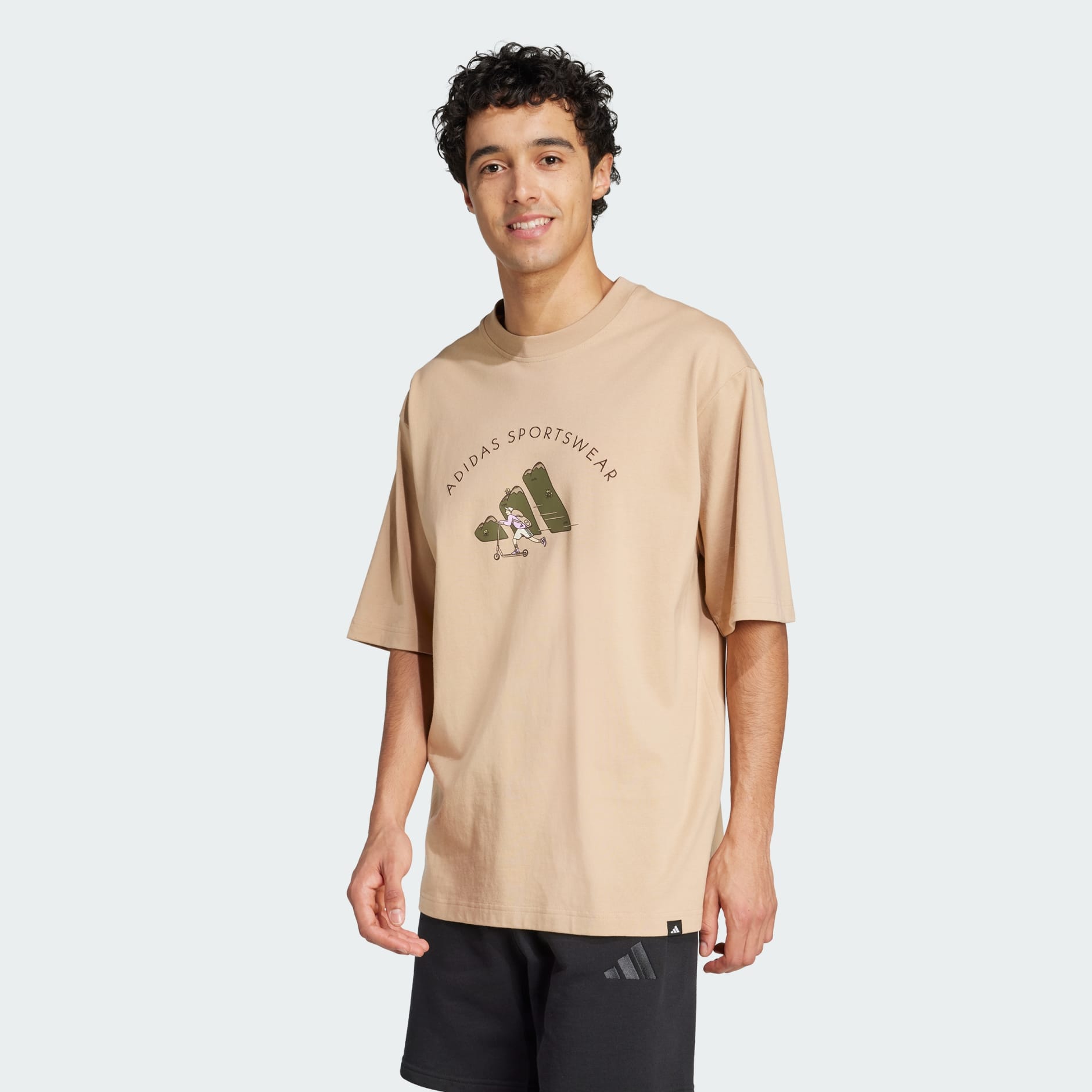 Clothing - Codes Doodle Scooter Graphic Tee - Brown | adidas Oman